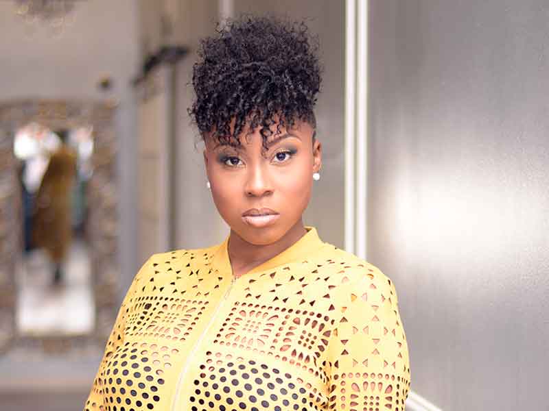 Mohawk Hairstyle with Tight Bangs and Tapered Sides